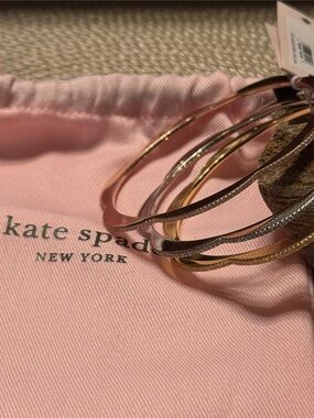 kate spade trio of metallic bangles in rose gold, gold, and silver